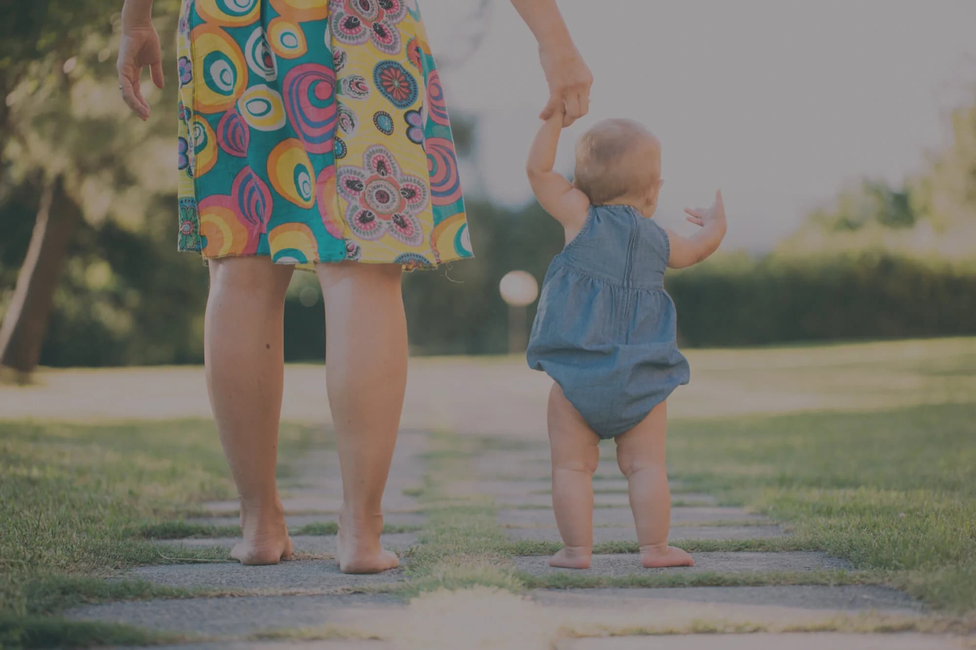 child walking with parent